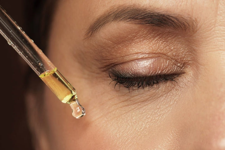 mature woman applying face for her facial oil by hairmetto