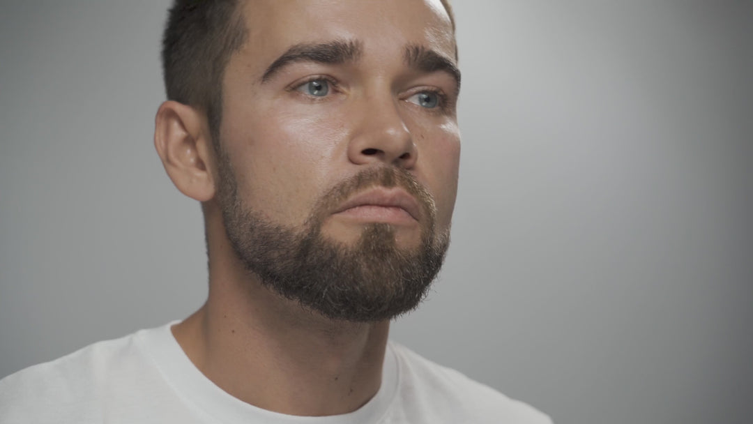 man grooming beard after applying face for him facial oil by hairmetto